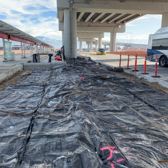 Trax east sidewalk prep and heat February 2021