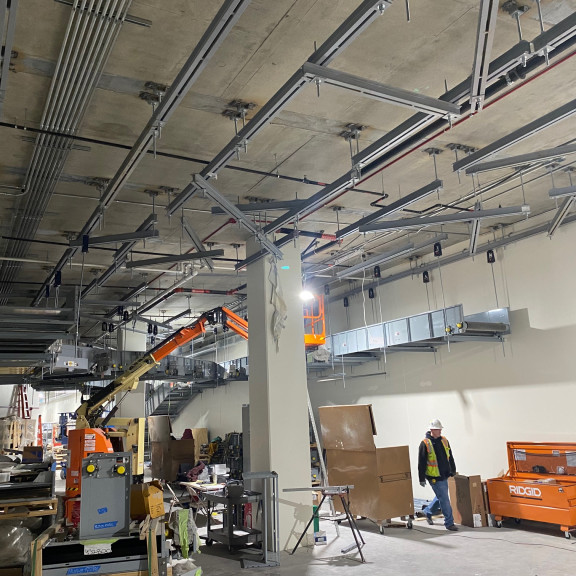 Tunnel installing baggage conveyor supports December 2022