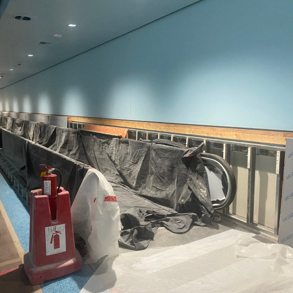 Tunnel moving walkway 01 up light mill work install October 2023